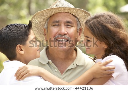 Grandfather With Grandchildren In Garden