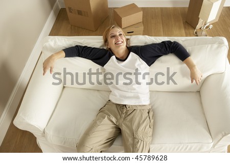 Overhead View Of Young Woman Moving Into New Home