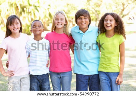 Portrait Of Group Of Children Playing In Park