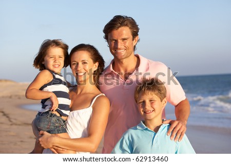 Portrait Of Family On Beach Holiday