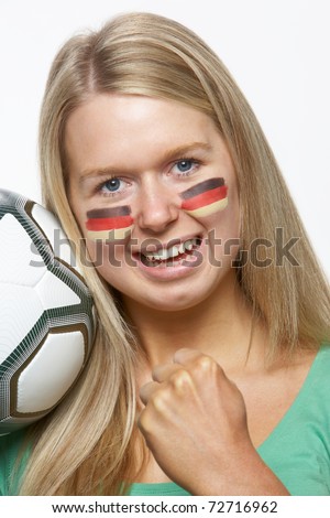 Young Female Sports Fan With German Flag Painted On Face
