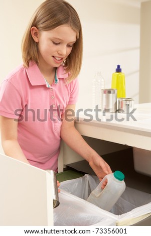 Young Girl Recyling Waste At Home