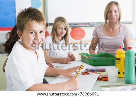 Students in art class with teacher (selective focus)
