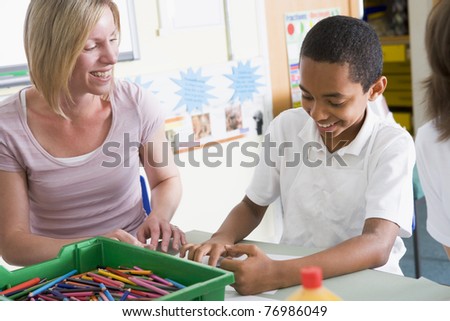 Student in art class with teacher
