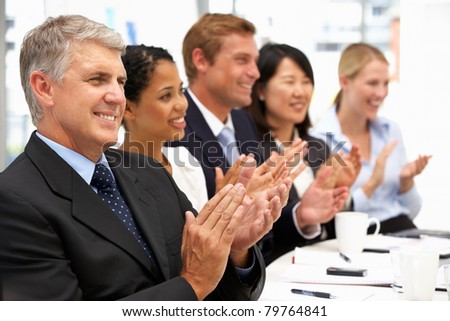 Business people clapping