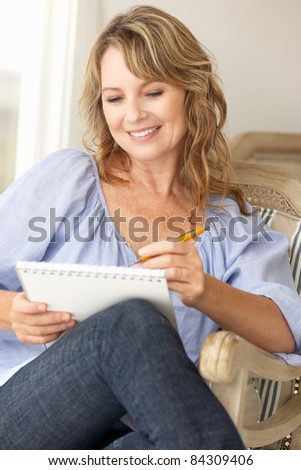 Mid age woman sketching