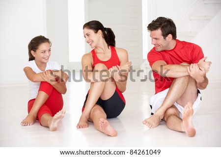 Mother father and daughter doing yoga Mother father and daughter doing yoga