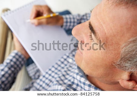 Mid age man sketching