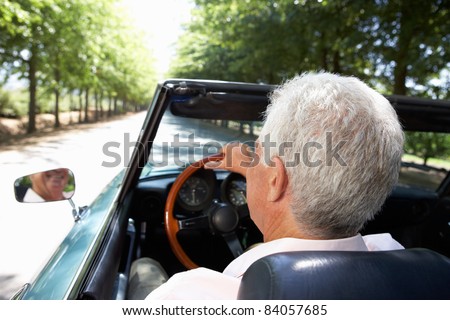 Senior man in sports car