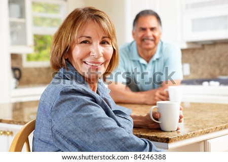 Senior couple relaxing in kitchen