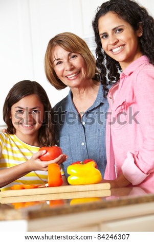 Mother,daughter and grandmother cooking