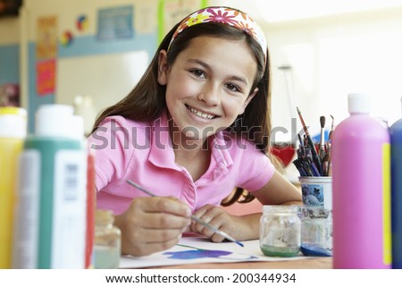 Pre teen girl in art class