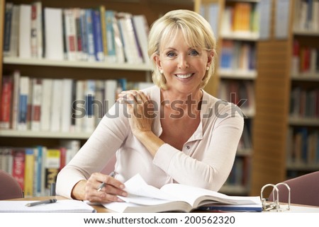 Senior student working in library