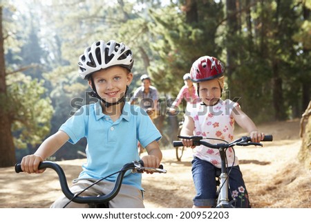 Young family on country bike ride