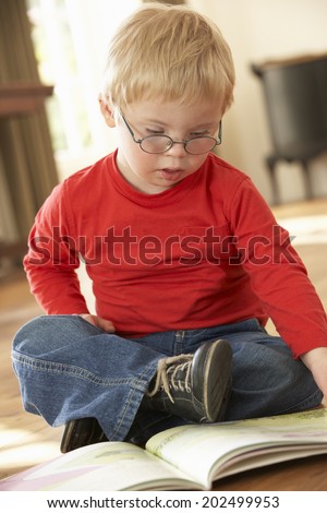 4 year old boy with Downs Syndrome reading