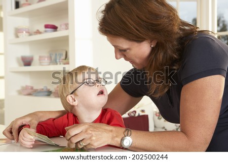 Downs Syndrome boy having speech therapy