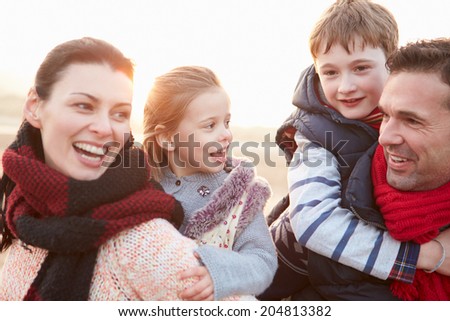 Portrait Of Family On Winter Beach