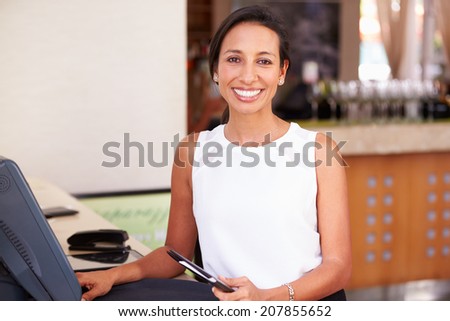 Portrait Of Waitress In Hotel Restaurant Preparing Bill