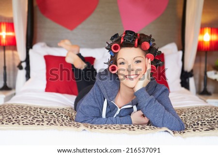 Bride Getting Ready For Wedding With Hair In Curlers