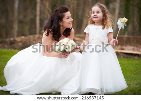 Bride With Bridesmaid On Wedding Day