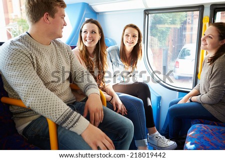 Group Of Young People On Bus Journey Together
