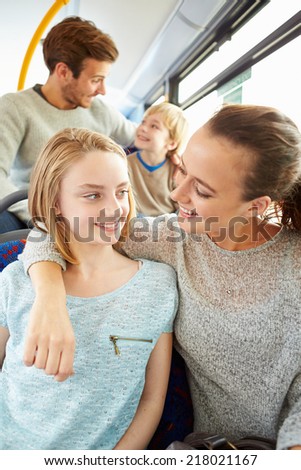 Family Enjoying Bus Journey Together
