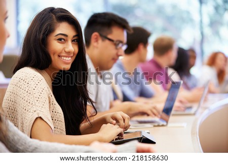 Class Of University Students Using Laptops In Lecture