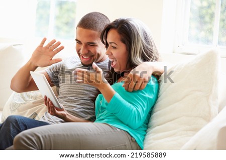 Young Couple Making Video Call Using Digital Tablet