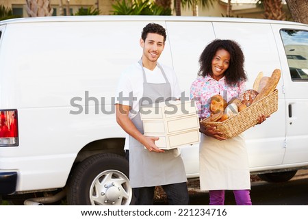 Bakers Unloading Bread And Cakes From Van