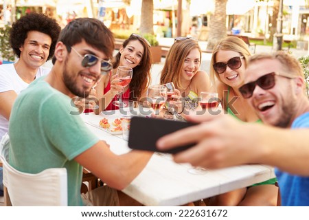 Group Of Friends Taking Selfie During Lunch Outdoors