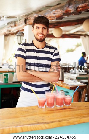 Portrait Of Man In Restaurant Making Fruit Smoothies