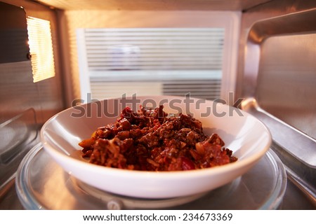 Leftover Chili Cooking Inside Microwave Oven