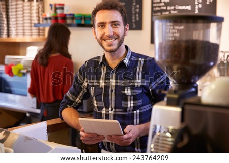 Portrait Of Couple Running Coffee Shop Together