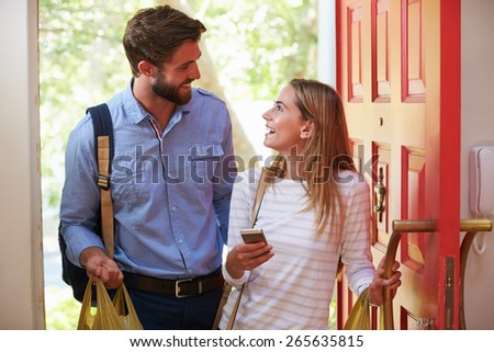 Young Woman Couple Home For Work With Shopping