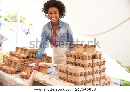 Woman Selling Fresh Eggs At Farmers Food Market