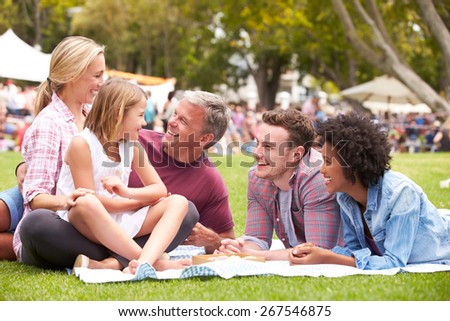 Older Family Relaxing At Outdoor Summer Event