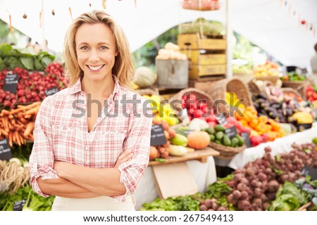 Female Stall Holder At Farmers Fresh Food Market