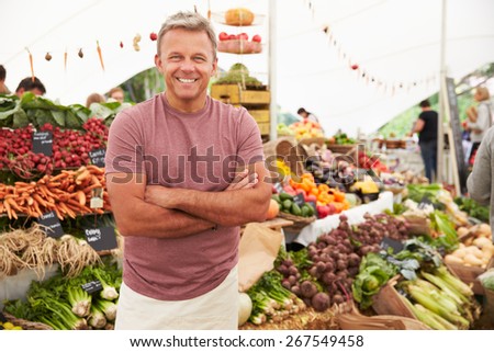 Male Stall Holder At Farmers Fresh Food Market