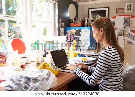 Woman On Laptop Running Business From Home Office