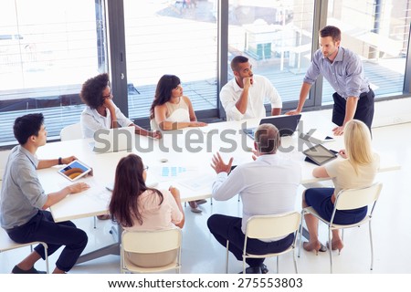 Businessman presenting to colleagues at a meeting