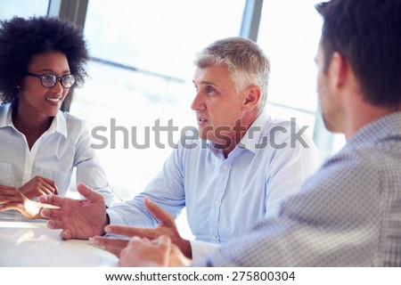 Three business professionals working together