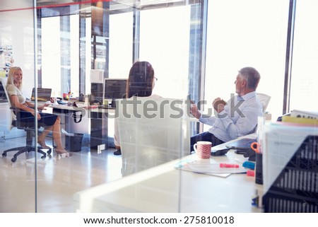 Group of people talking in the office