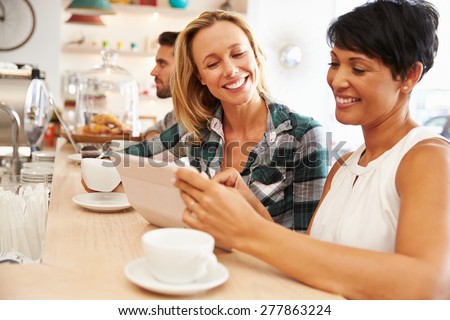 Two women at a meeting in a cafe