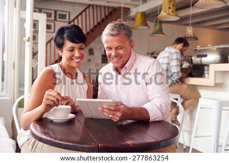 Middle aged couple in a cafe