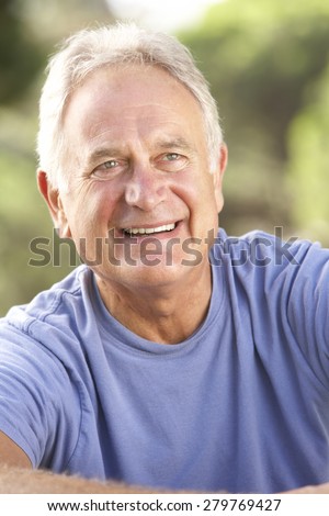 Portrait Of Senior Man Relaxing In Countryside