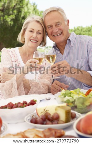 Senior Couple Enjoying Outdoor Meal Together