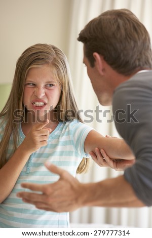 Father Telling Off Daughter At Home