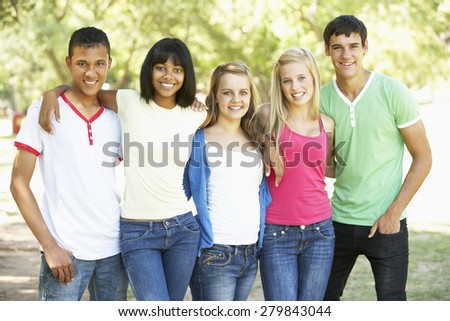 Group Of Teenage Friends Standing In Park