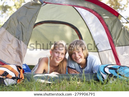 Teenage Couple On Camping Holiday In Countryside