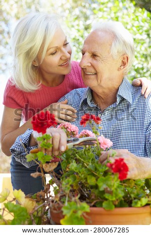 Mid age woman and father in garden